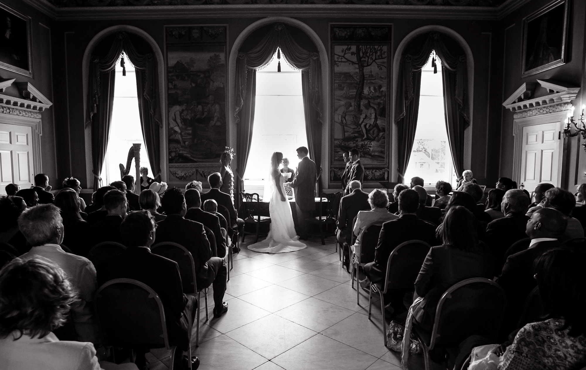 Black and white photograph of a couple during their wedding ceremony taken by wedding photographer Richard Eaton.