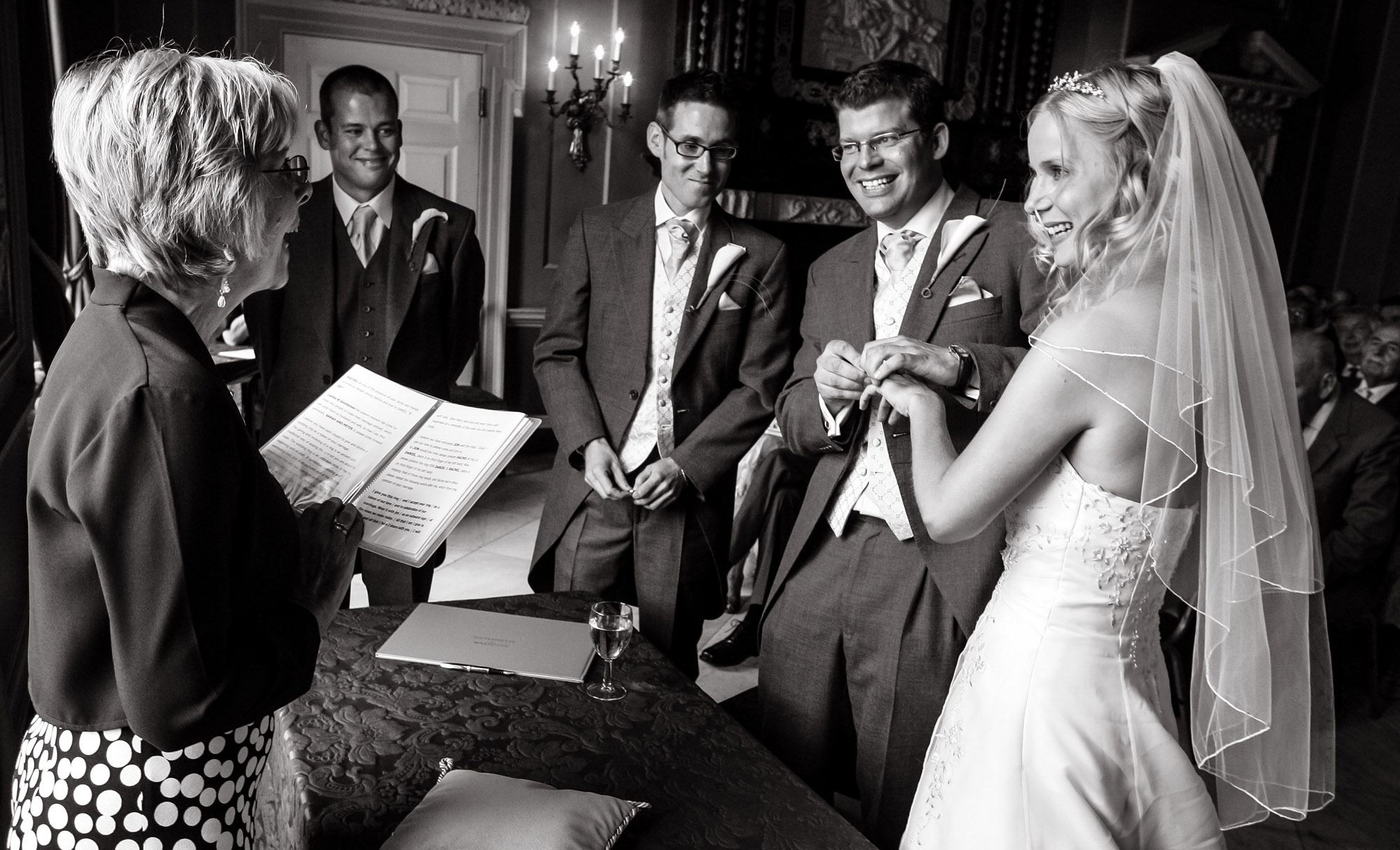 Black and white photograph of a couple during their wedding ceremony taken by wedding photographer Richard Eaton.