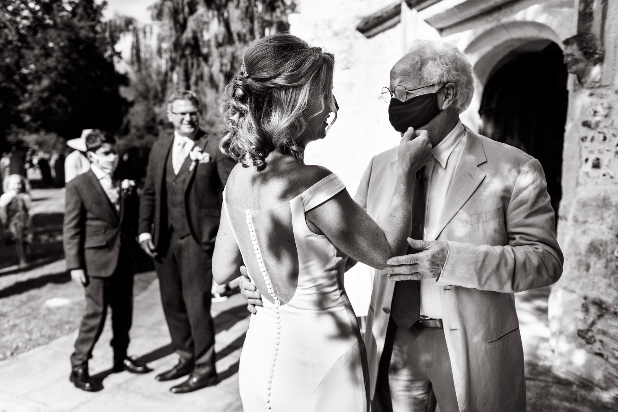 A photograph of a newly married bride and her father after her wedding ceremony taken by wedding photographer Richard Eaton.