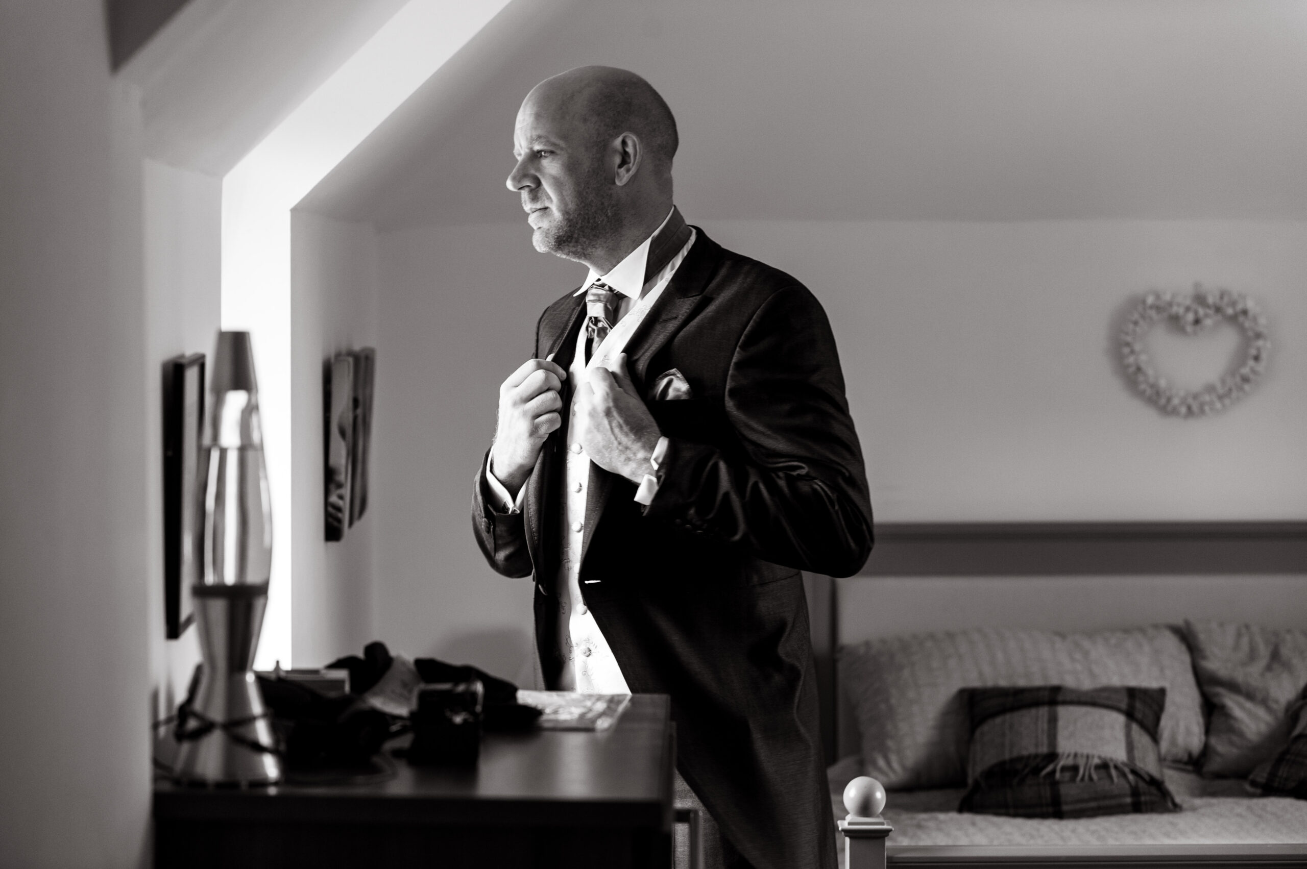 Groom getting ready on his wedding day taken by Surrey based wedding photographer Richard Eaton. 